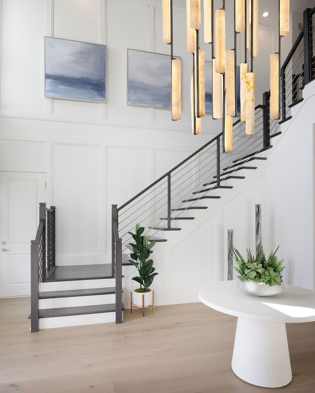 Modern living room with a fireplace, sectional sofa, and decorative elements.