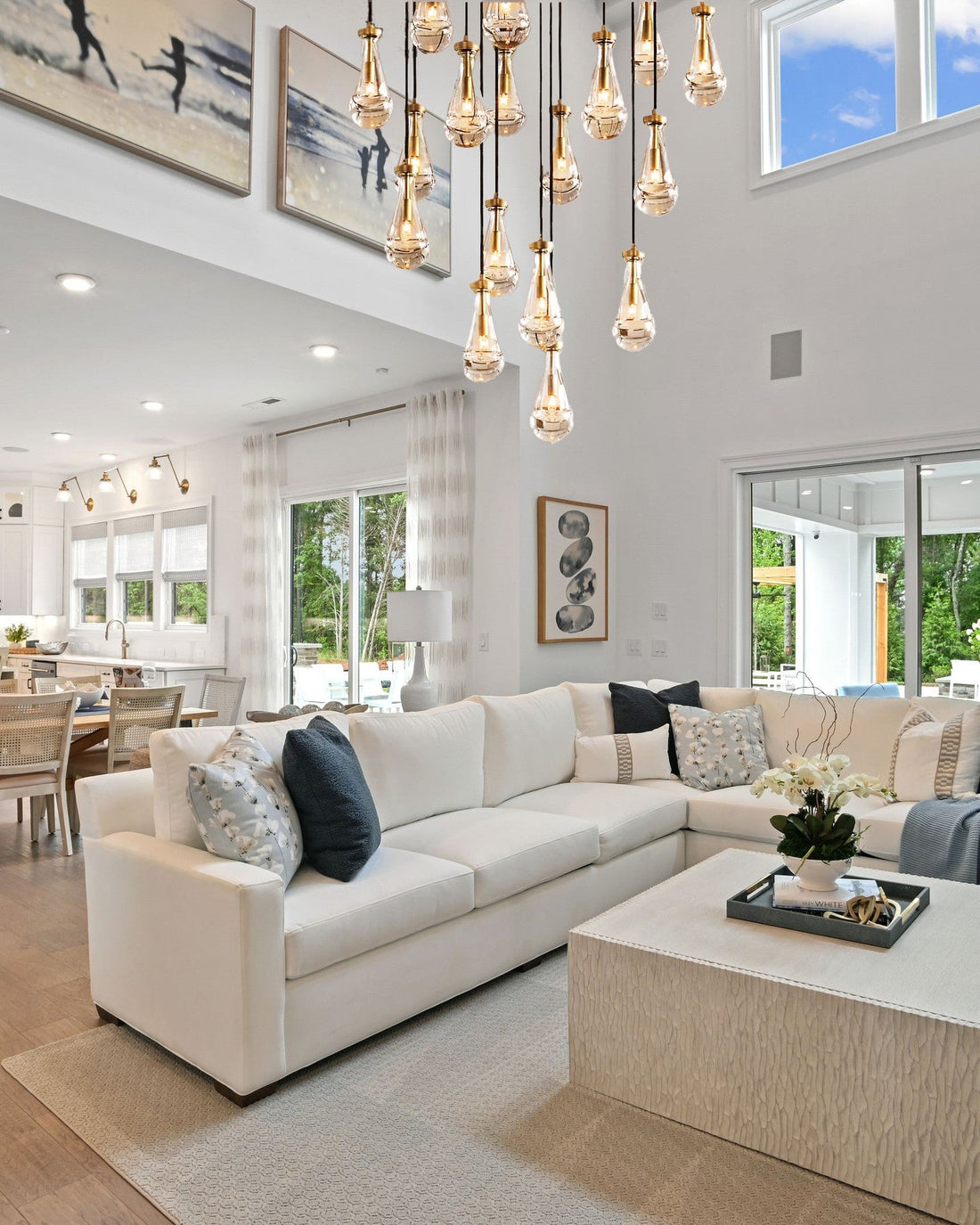 Modern living room with staircase, fireplace, and decorative elements.